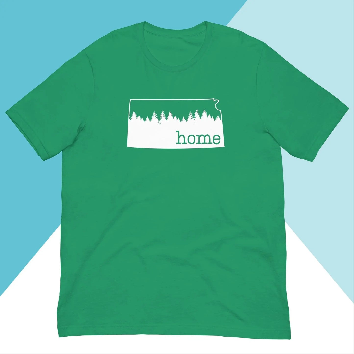 The Kansas Home Pine Trees Unisex Shirt by North Owl Apparel is a stylish green tee with a white outline of Kansas, tree silhouettes inside, and home beneath. Made from high-quality cotton, its background is split diagonally in white and two shades of blue, celebrating Kansas pride.