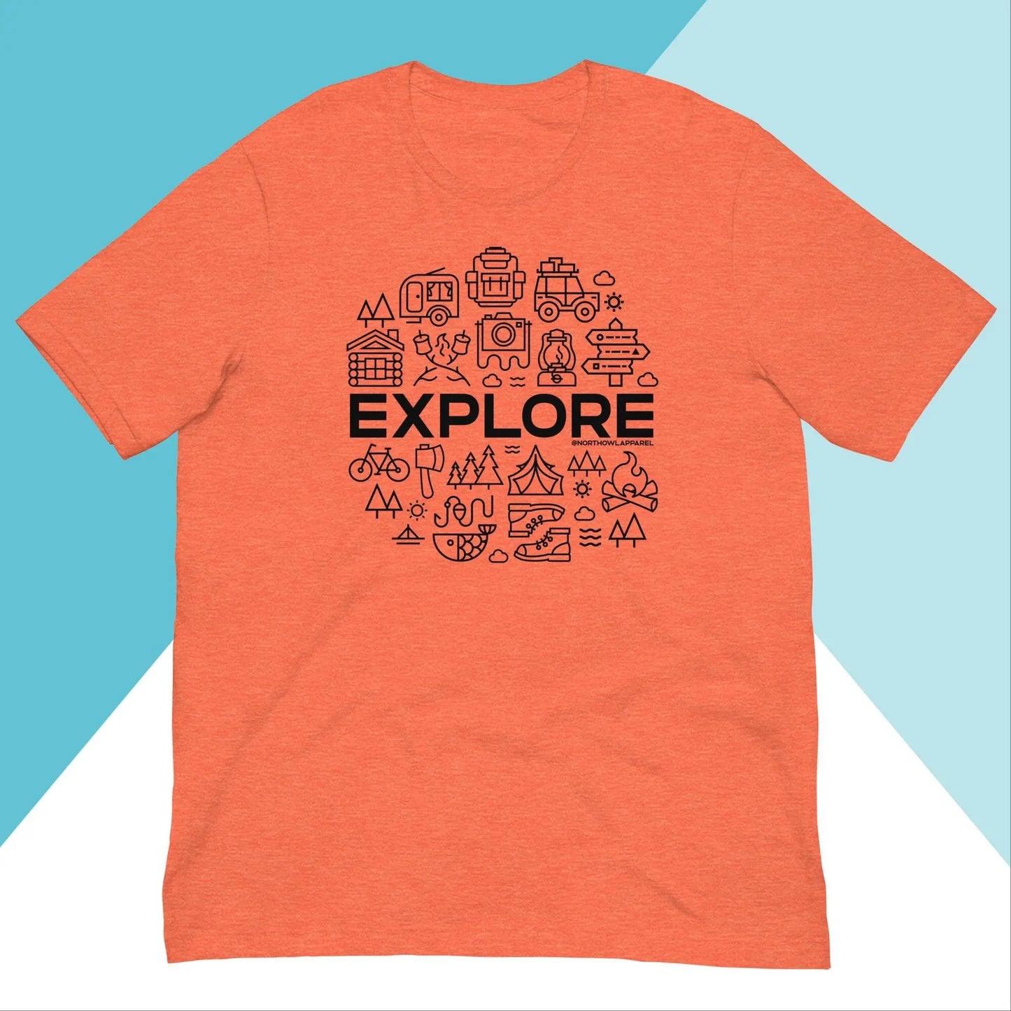 The Explore Outdoors Camping Unisex Shirt by North Owl Apparel features an orange base with EXPLORE in black letters, surrounded by camera, tent, and mountain icons. Its split light blue and white geometric design captures the adventurous spirit of outdoor exploration.