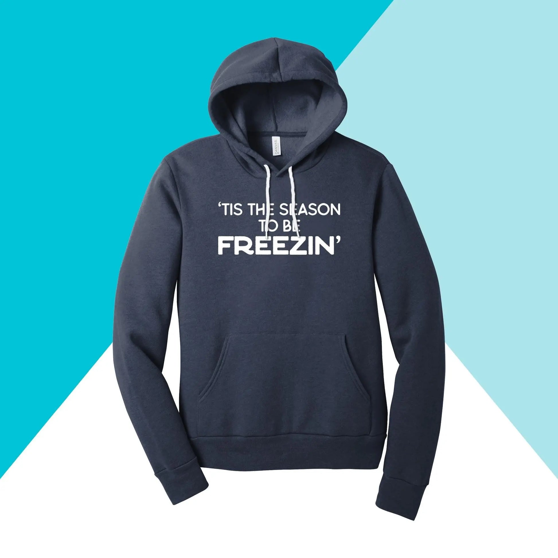 Stay cozy with the North Owl Apparels Tis the Season to be Freezin Unisex Hoodie. This navy blue hoodie showcases a bold white print on a two-tone diagonal blue background, perfect for embracing the chill in style.